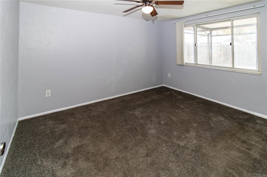 4150 Newbury Drive New Port Richey, FL 34652 - Photo 12 of 32 an empty room with a window