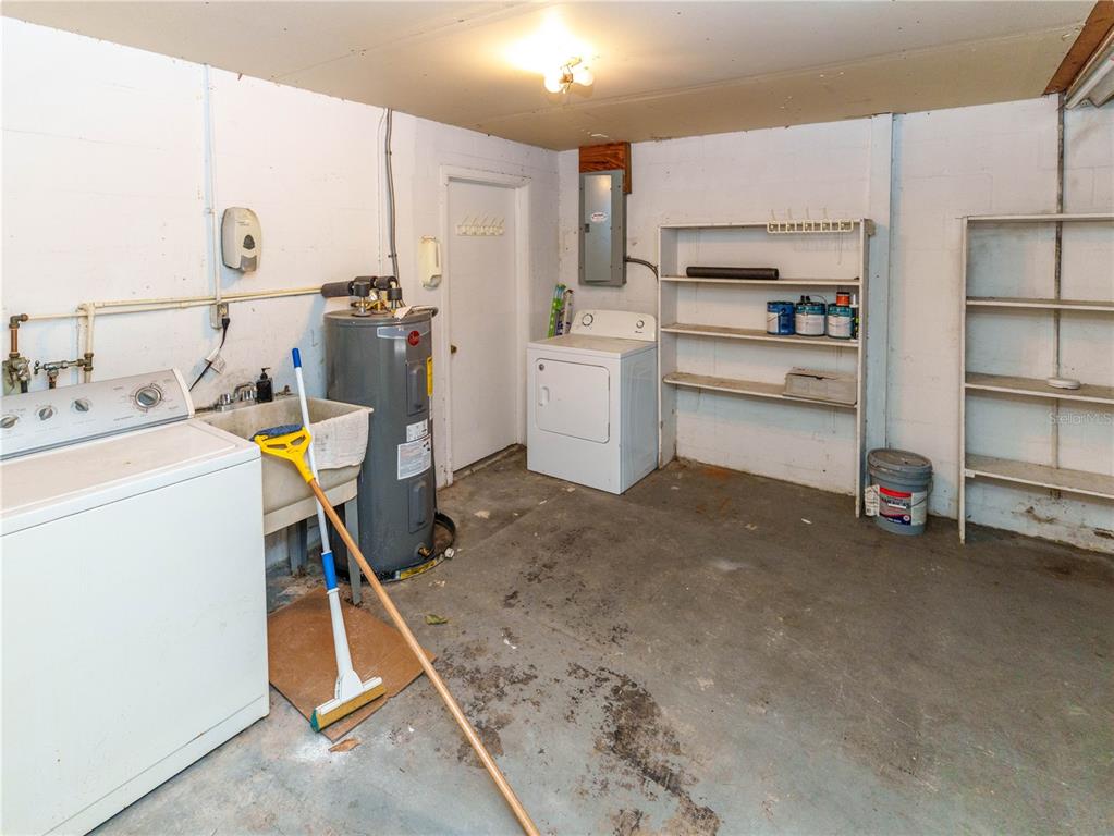 4150 Newbury Drive New Port Richey, FL 34652 - Photo 18 of 32 a storage room with washer and dryer