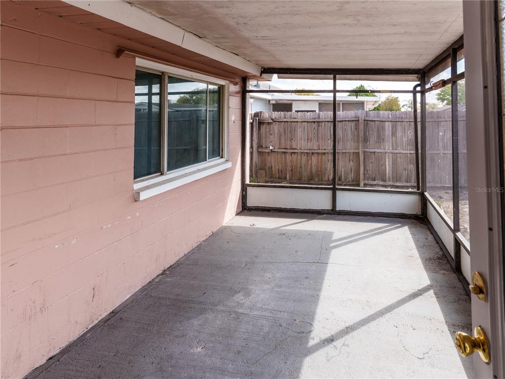 4150 Newbury Drive New Port Richey, FL 34652 - Photo 20 of 32 a view of a room with sliding glass door