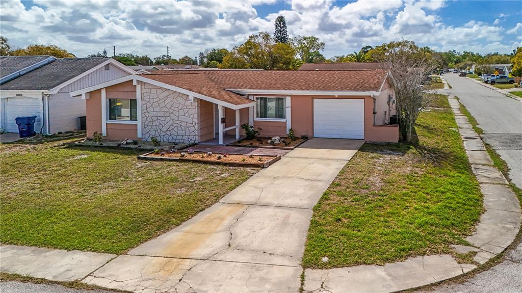 4150 Newbury Drive New Port Richey, FL 34652 - Photo 23 of 32 a view of a house with swimming pool and sitting area