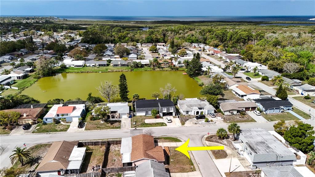 4150 Newbury Drive New Port Richey, FL 34652 - Photo 28 of 32 a view of a swimming pool and an ocean view