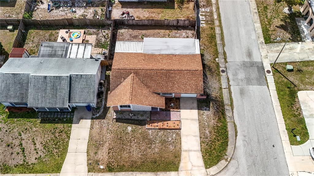 4150 Newbury Drive New Port Richey, FL 34652 - Photo 31 of 32 a aerial view of a house with a garden