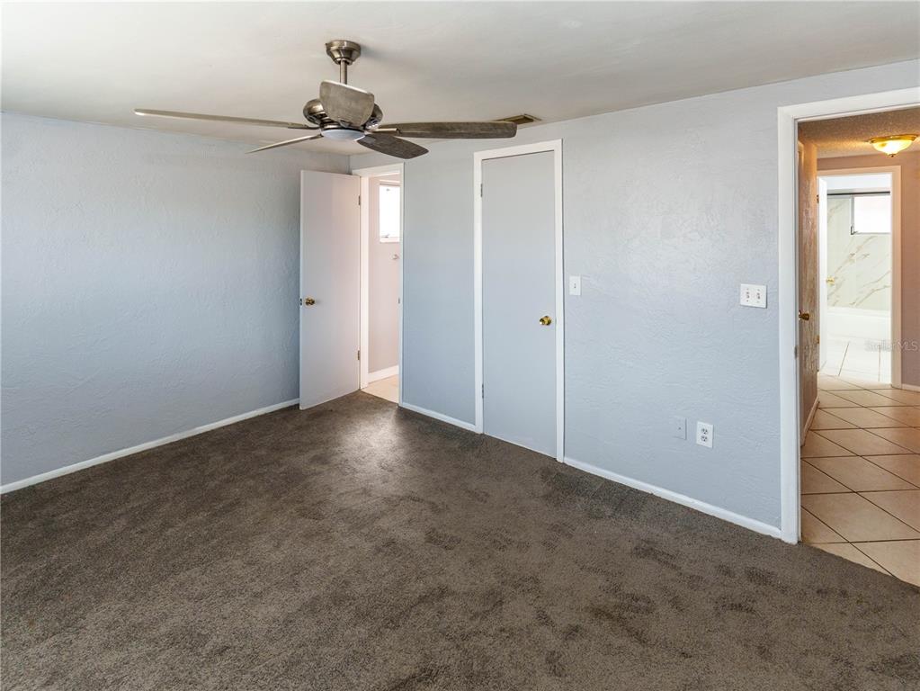 4150 Newbury Drive New Port Richey, FL 34652 - Photo 5 of 32 a view of empty room with a ceiling fan