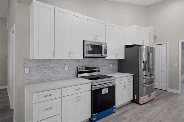 a bathroom with a sink a vanity and window