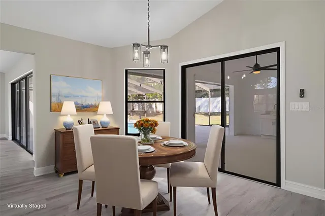 a living room with furniture a flat screen tv and a rug