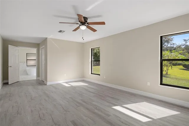 a bathroom with double vanity sink a mirror and a toilet