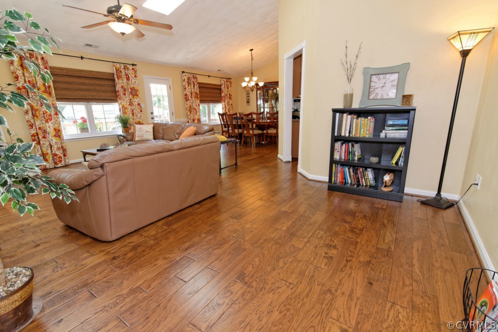 9318 Alcove Grove Road Chesterfield, VA 23832 - Photo 3 of 20 a living room with furniture and a book shelf
