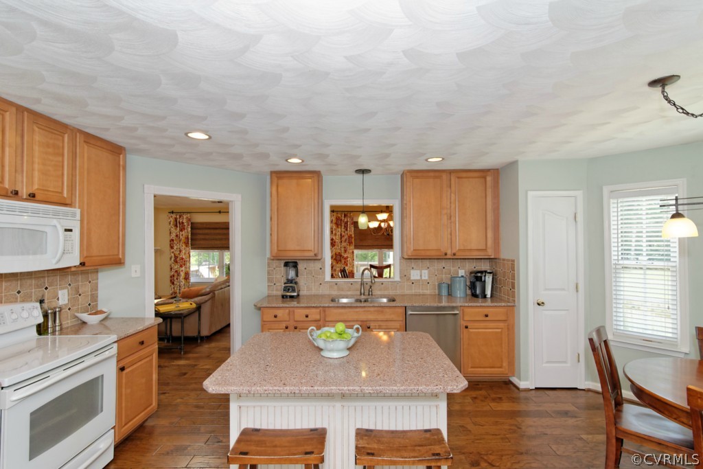 9318 Alcove Grove Road Chesterfield, VA 23832 - Photo 6 of 20 a kitchen with stainless steel appliances granite countertop a sink stove and cabinets