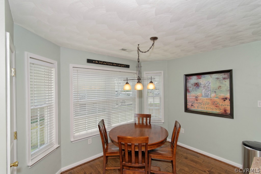 9318 Alcove Grove Road Chesterfield, VA 23832 - Photo 7 of 20 a view of a dining room with furniture window and wooden floor