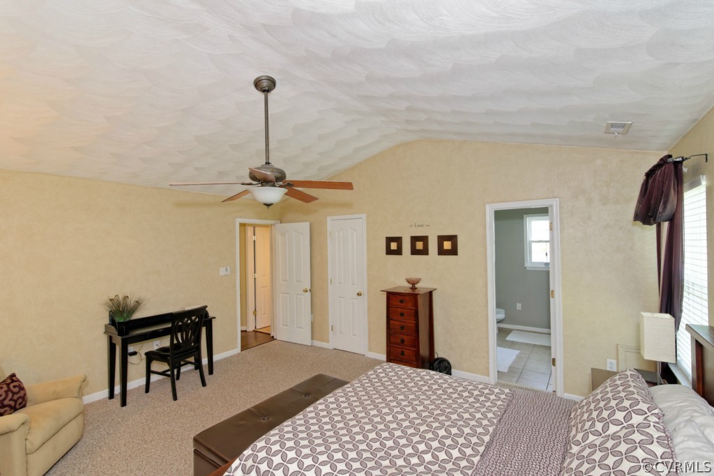 9318 Alcove Grove Road Chesterfield, VA 23832 - Photo 9 of 20 a bedroom with a bed and a chandelier