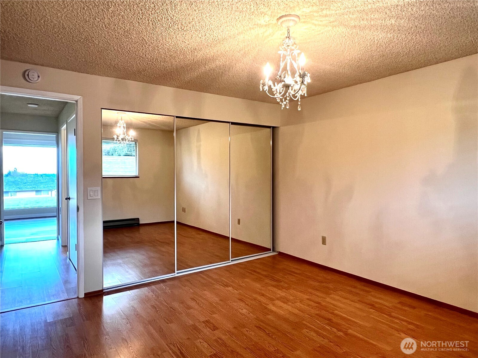 1301 South 3rd Avenue, Unit 5B Sequim, WA 98382 - Photo 14 of 24 a view of an empty room with wooden floor