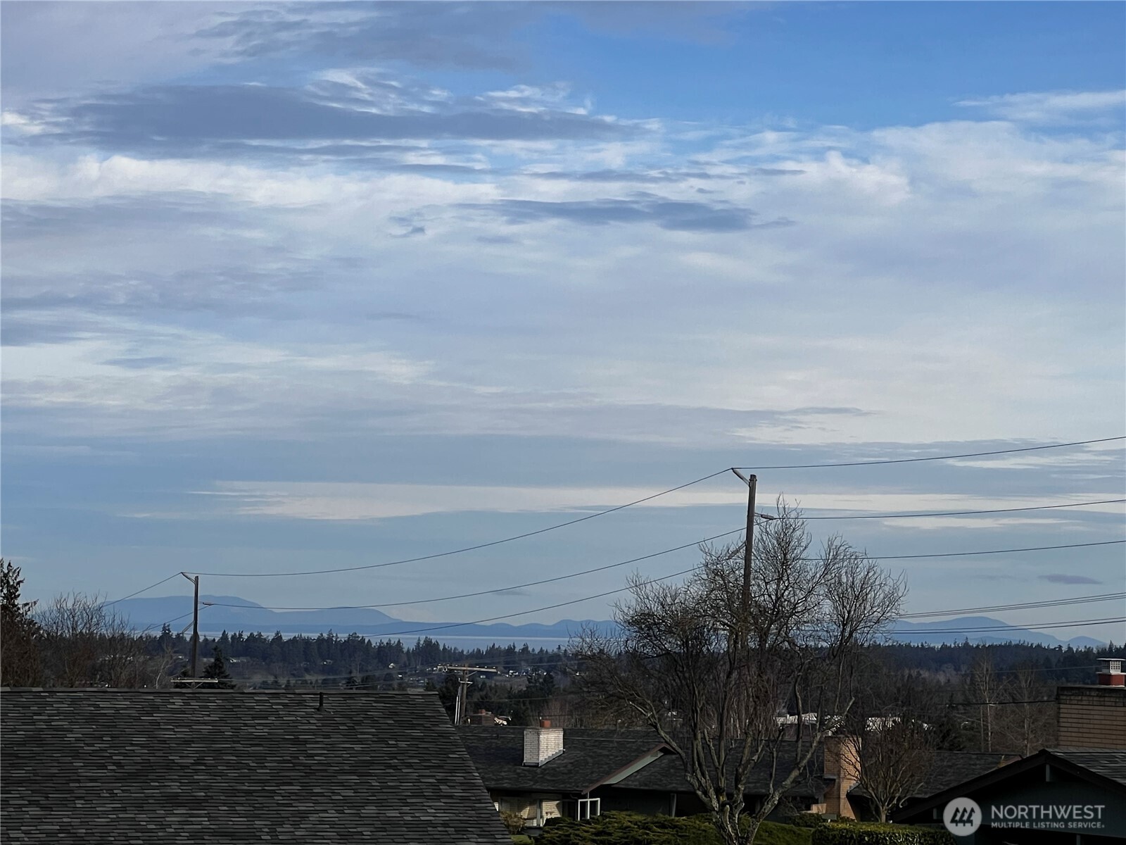 1301 South 3rd Avenue, Unit 5B Sequim, WA 98382 - Photo 2 of 24 a view of a lake and mountain