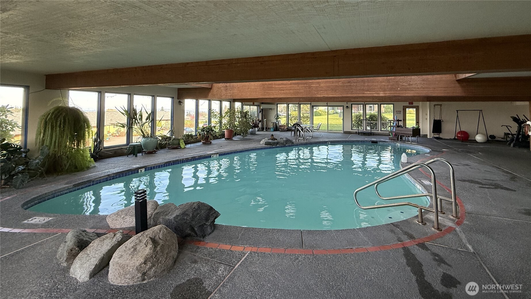 1301 South 3rd Avenue, Unit 5B Sequim, WA 98382 - Photo 23 of 24 a view of a swimming pool and outdoor space