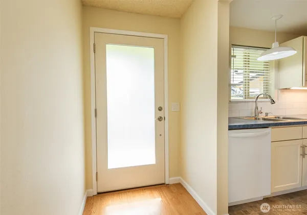 a view of a bathroom from a hallway