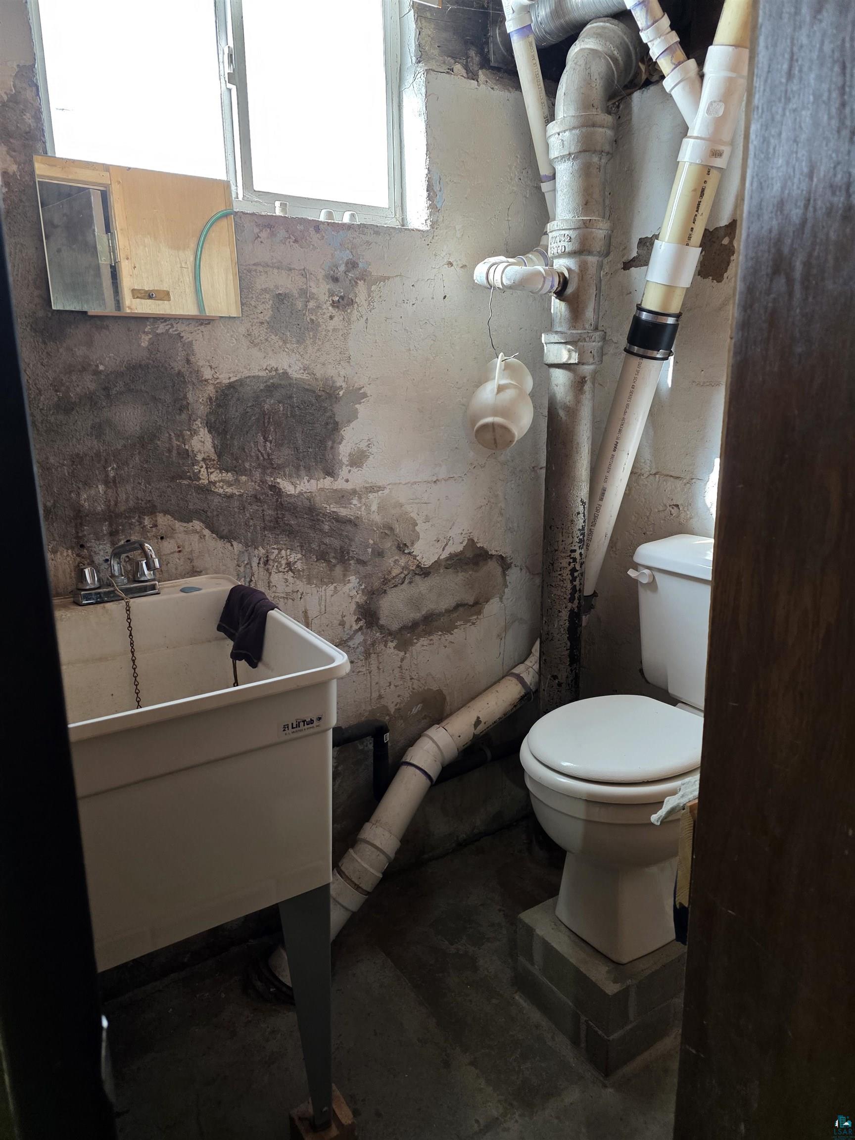 406 North Road Cloquet, MN 55720 - Photo 14 of 26 Bathroom featuring unfinished concrete flooring