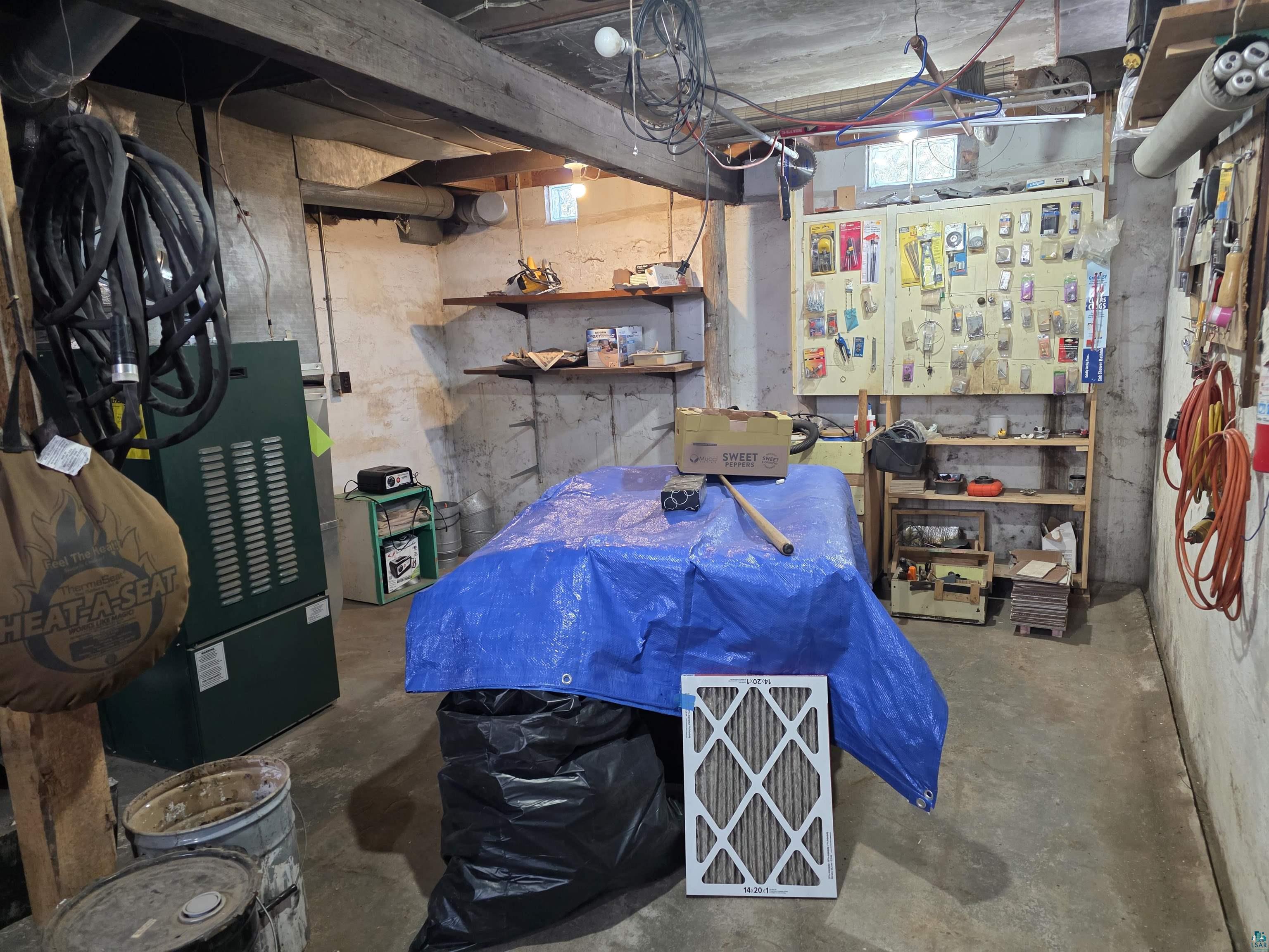 406 North Road Cloquet, MN 55720 - Photo 15 of 26 Unfinished basement featuring a workshop area