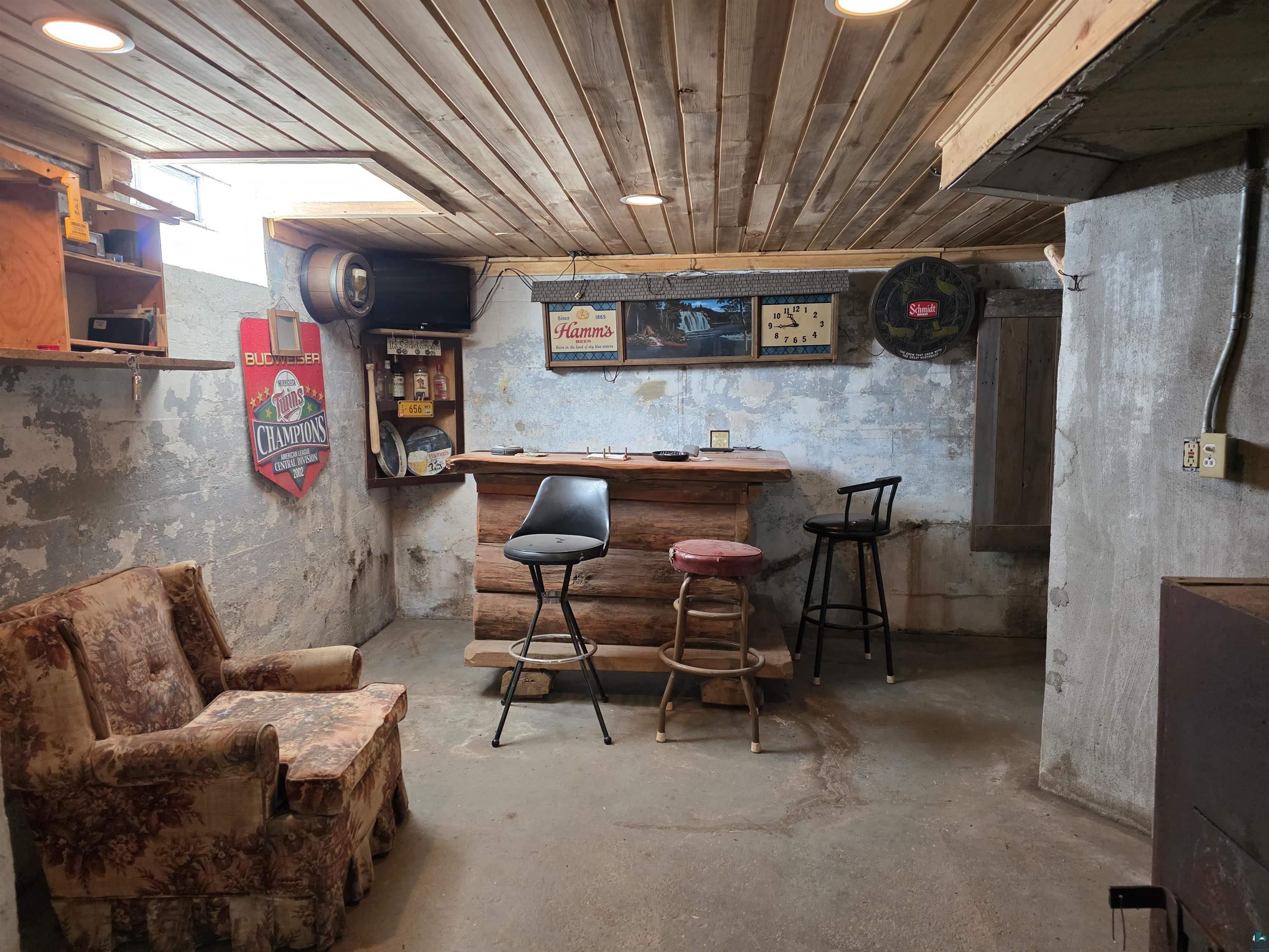 406 North Road Cloquet, MN 55720 - Photo 16 of 26 Indoor dry bar featuring concrete floors and wood ceiling