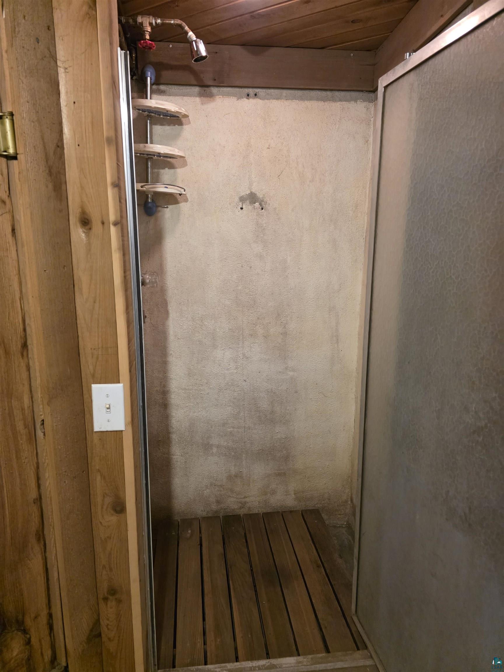 406 North Road Cloquet, MN 55720 - Photo 20 of 26 Full bath with a shower stall, hardwood / wood-style flooring, and wooden ceiling