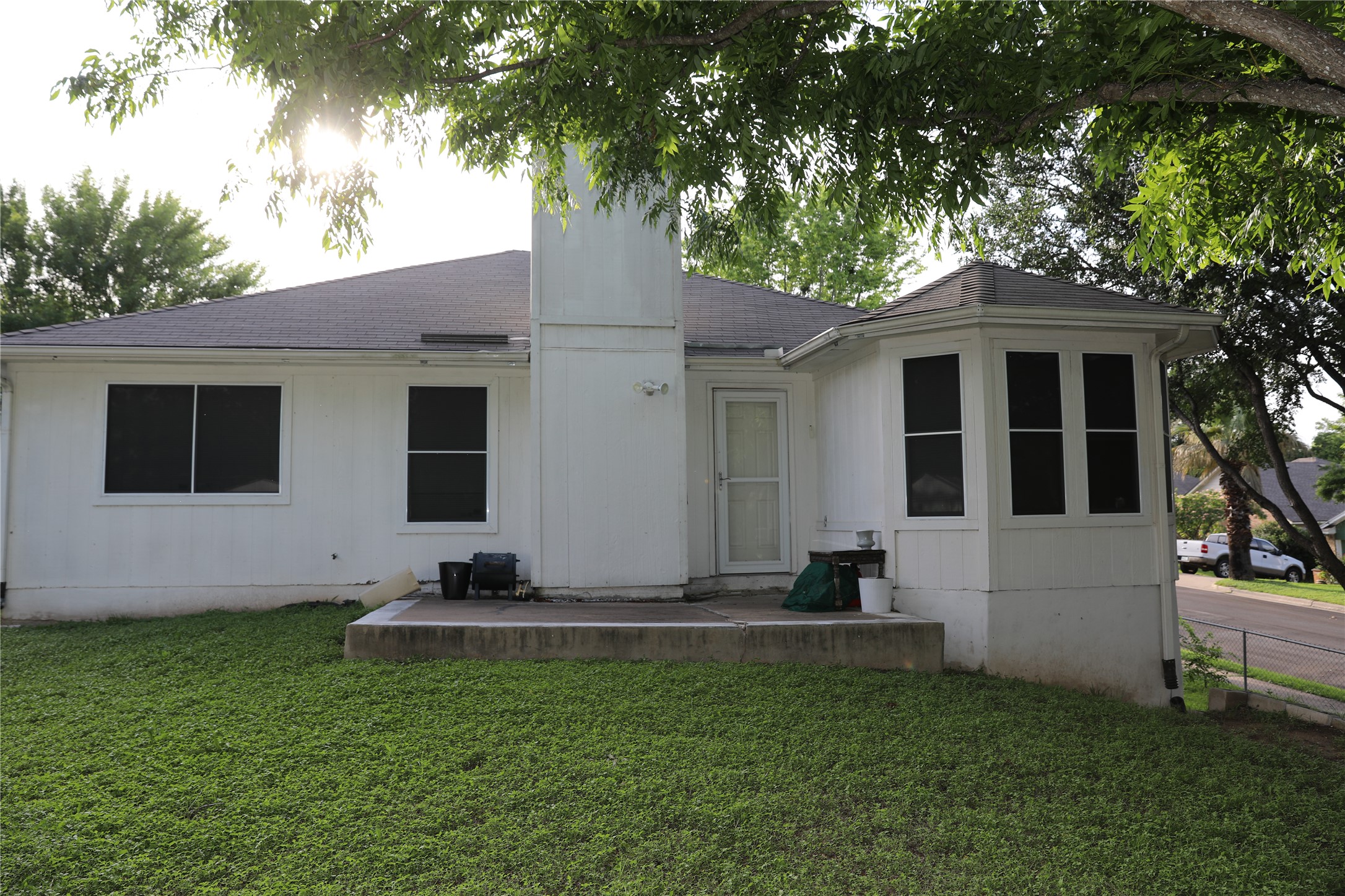 4901 Birch Creek Road Austin, TX 78744 - Photo 8 of 11 A quaint backyard patio extends from this charming residence, perfect for quiet enjoyment.