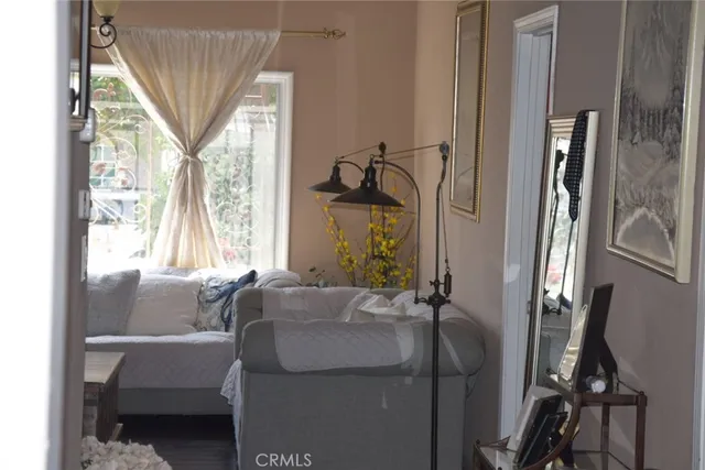 a room with a couch and a table and chairs