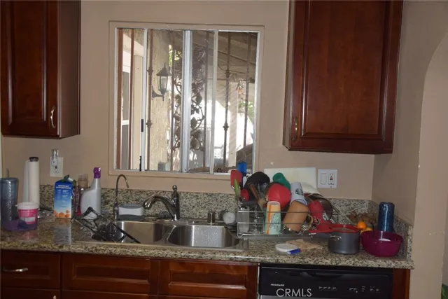 a kitchen with sink and cabinets