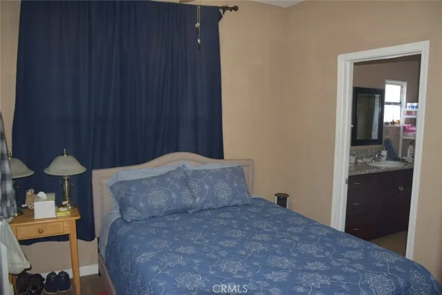 a bedroom with a bed and a dresser