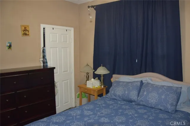 a room with a book shelf and a closet
