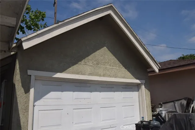 a front view of a house with parking area