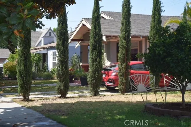a view of multiple houses with a yard