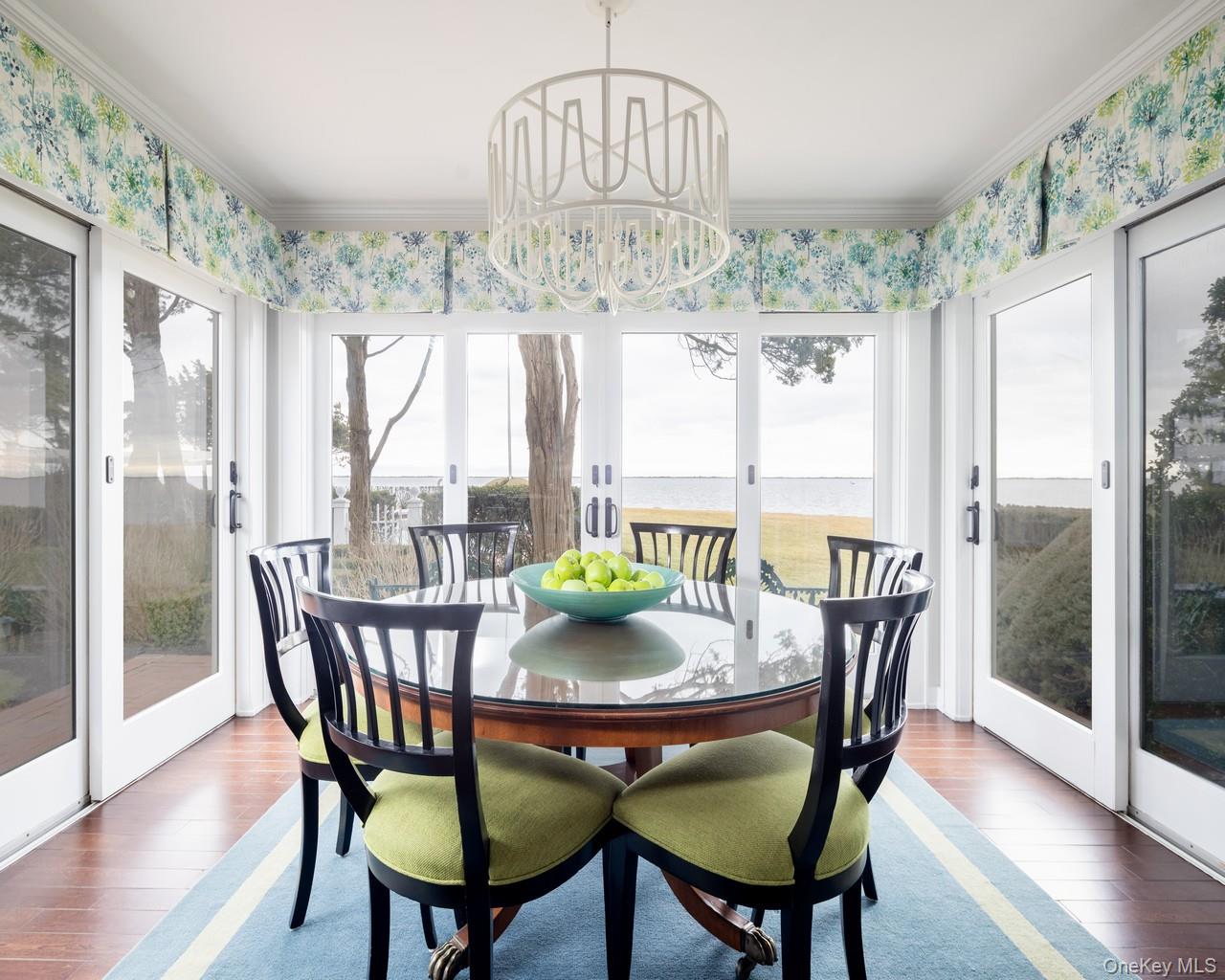 16 Point Road Bellport, NY 11713 - Photo 17 of 33 a view of a dining room with furniture window and wooden floor