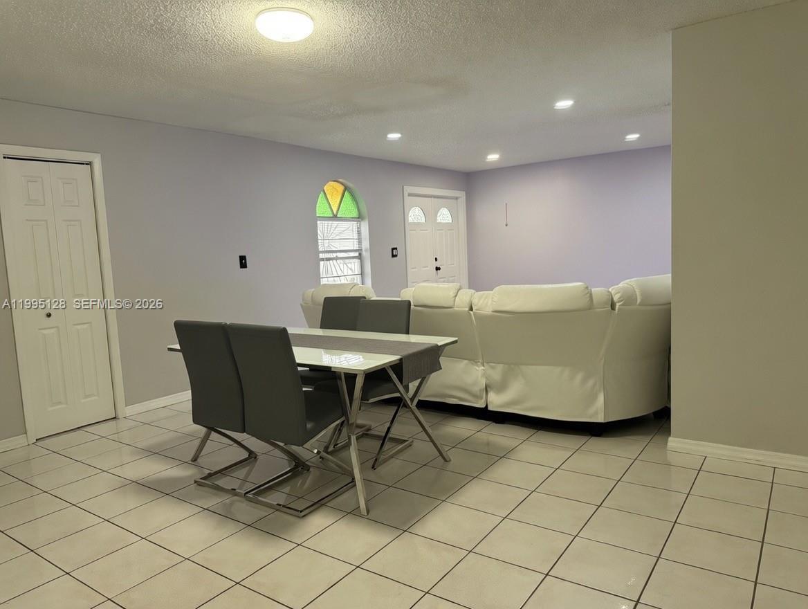 7440 Southwest 22nd Street, Unit 1 Miami, FL 33155 - Photo 3 of 16 It fits a table for 8.