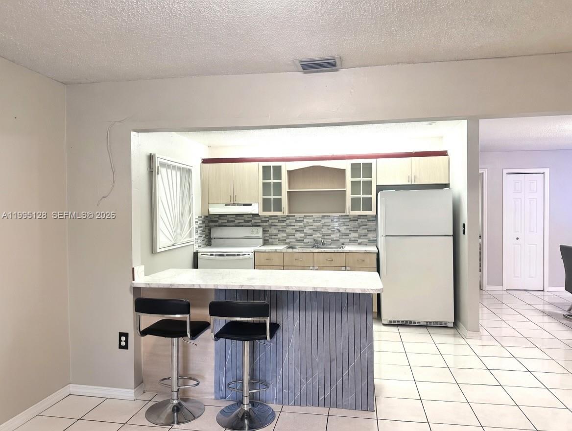 7440 Southwest 22nd Street, Unit 1 Miami, FL 33155 - Photo 4 of 16 Open kitchen with breakfast bar!