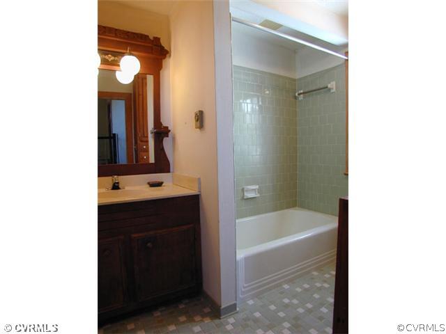 5821 Cox Road Wilsons, VA 23894 - Photo 3 of 12 a bathroom with a bathtub and a sink