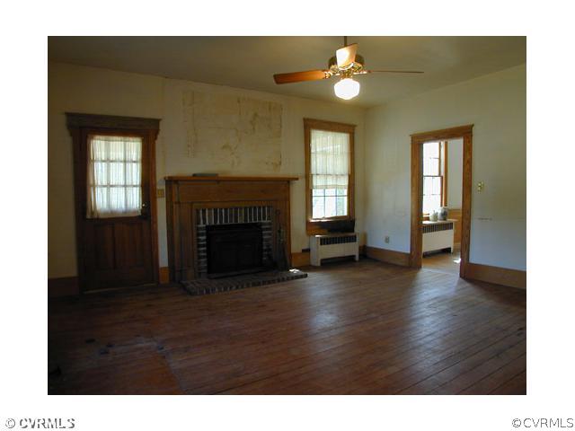 5821 Cox Road Wilsons, VA 23894 - Photo 6 of 12 a living room with furniture and a fireplace
