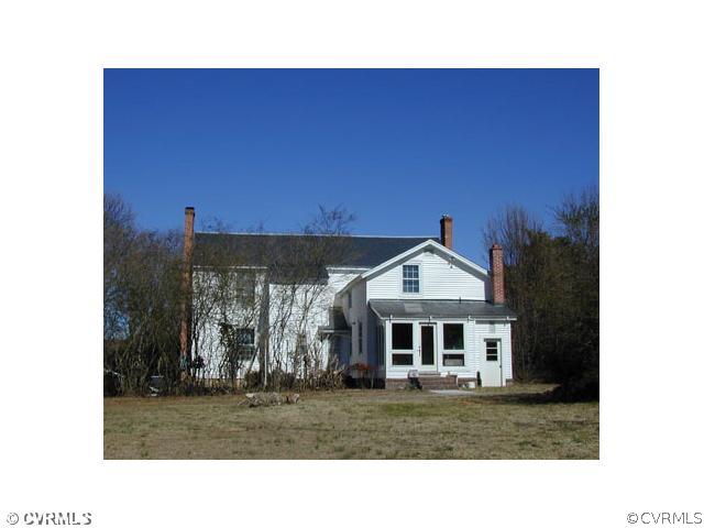 5821 Cox Road Wilsons, VA 23894 - Photo 8 of 12 a front view of a house with a yard