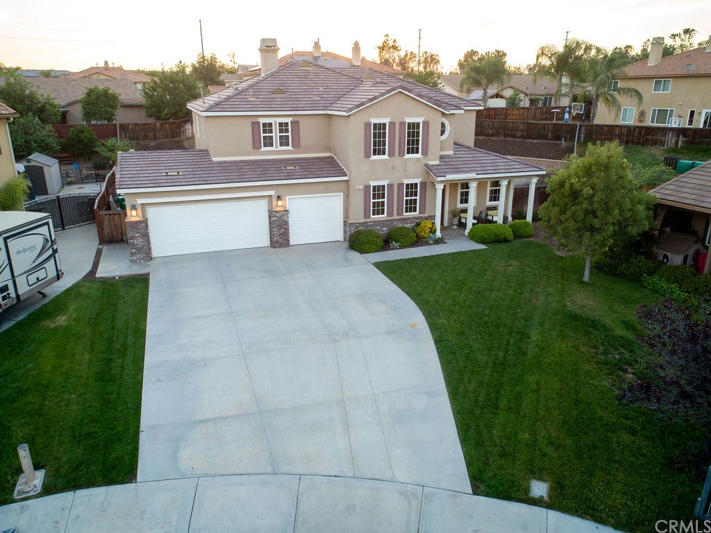 Front of Home with Tripple Wide Oversized Drive Way .... bring your RV ... no more RV Storage Fee's