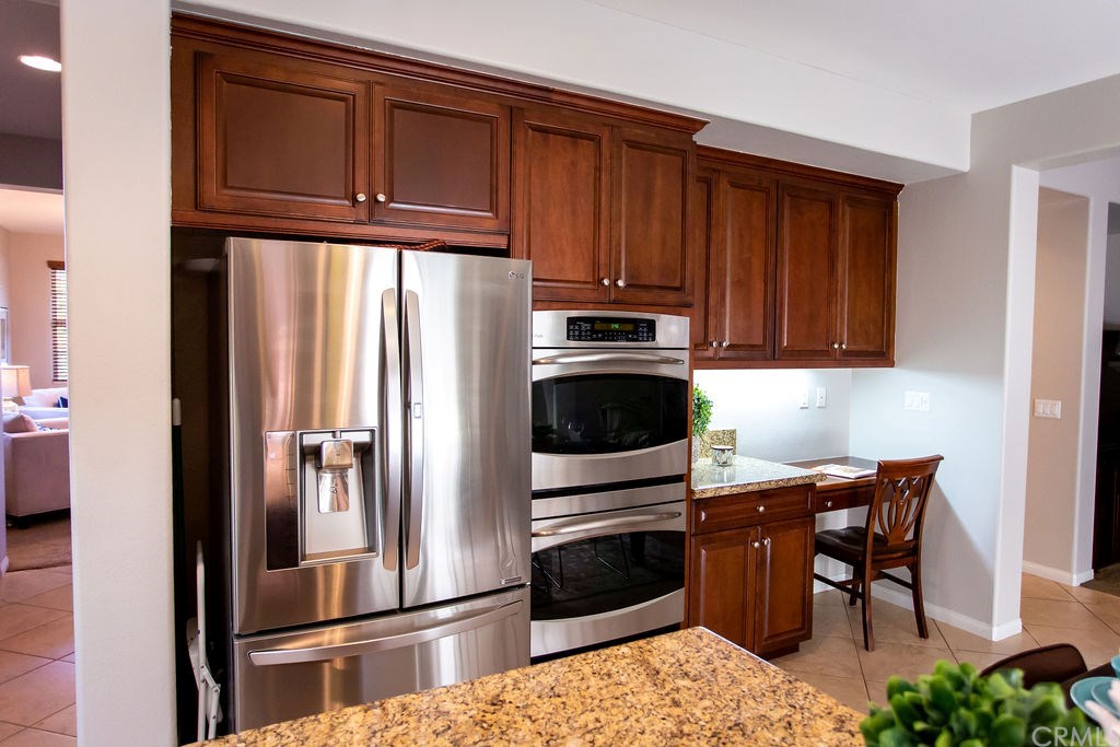 30118 Beeswing Circle Menifee, CA 92584 - Photo 19 of 73 Another View of this Amazing Kitchen w. a Peek A Boo View through the Butlers Pantry into the Formal Dining Room