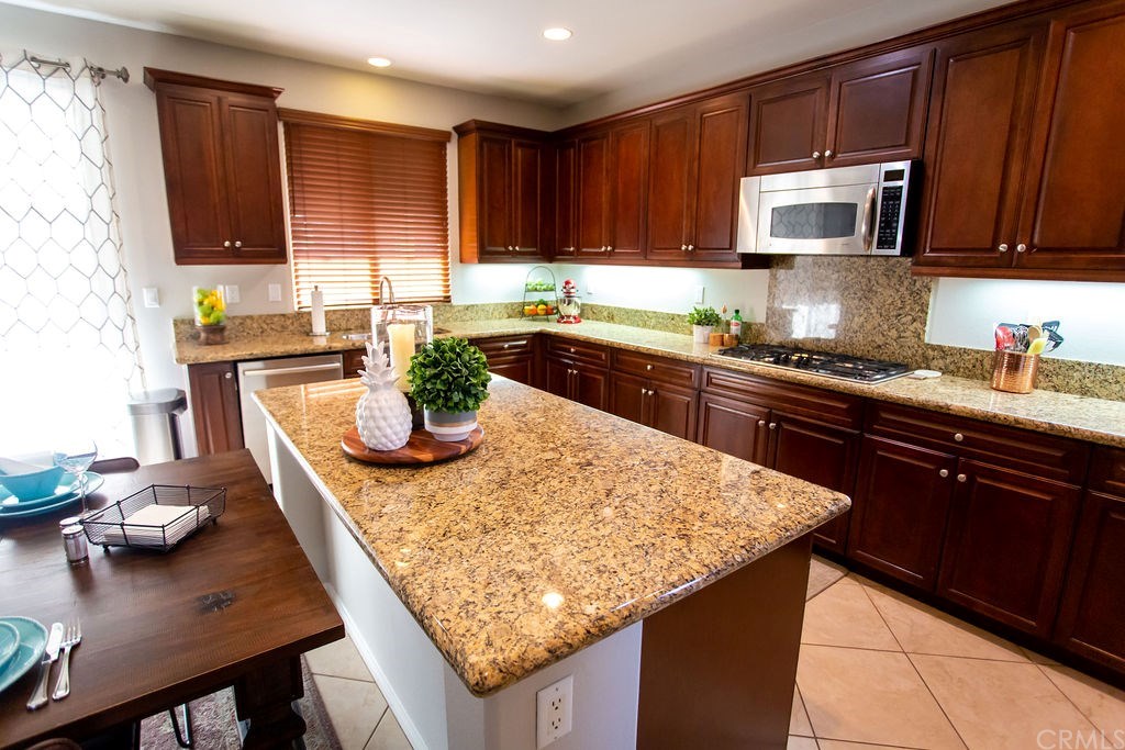 30118 Beeswing Circle Menifee, CA 92584 - Photo 22 of 73 Breakfast Bar and Tremendous Kitchen Countertops and Counterspace and again STAINLESS EVERYTHING !!!!