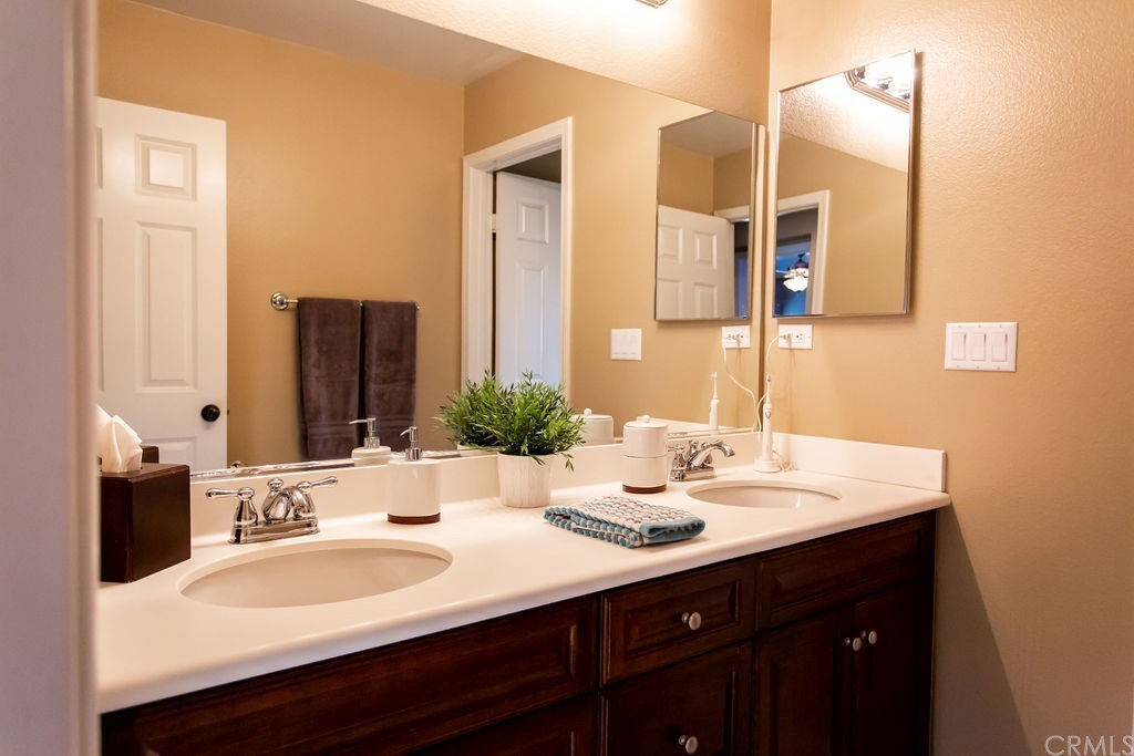 30118 Beeswing Circle Menifee, CA 92584 - Photo 41 of 73 Third Bathroom includes Double Sink-Solid Surface Countertops-Upgraded Custom Wood Cabinets as well as Upgraded Custom Paint