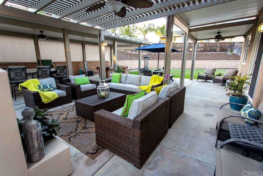 30118 Beeswing Circle Menifee, CA 92584 - Photo 62 of 73 More Seating behind the Living Room area really shows the depth of this Upgraded Custom Back Yard Project
