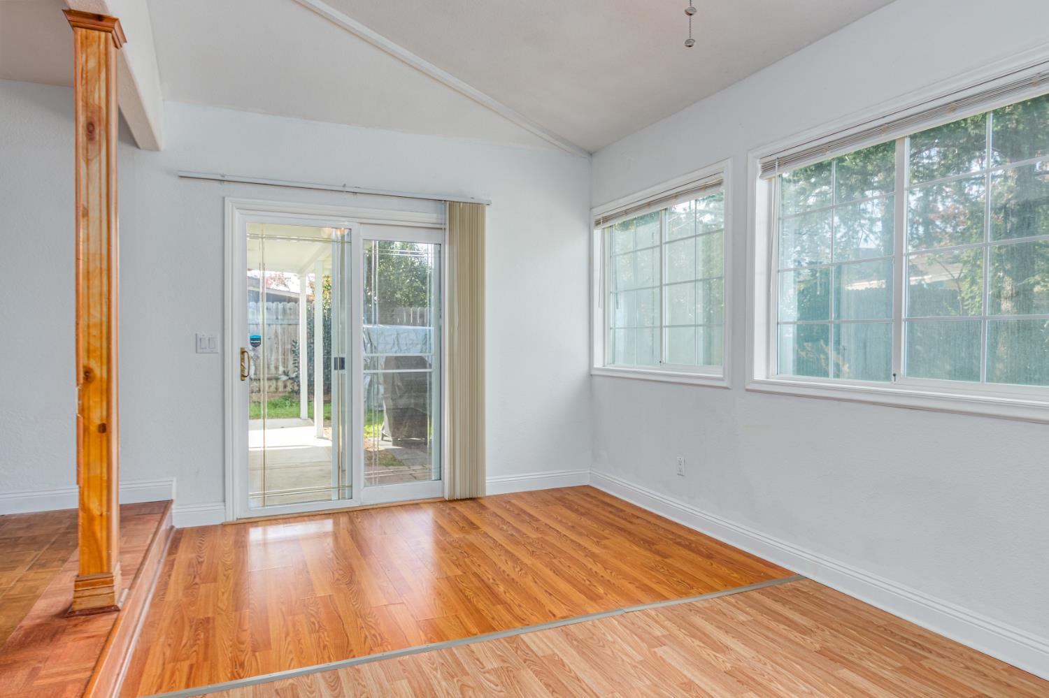 5651 Gerard Way Citrus Heights, CA 95621 - Photo 11 of 31 a view of an empty room with wooden floor and a window
