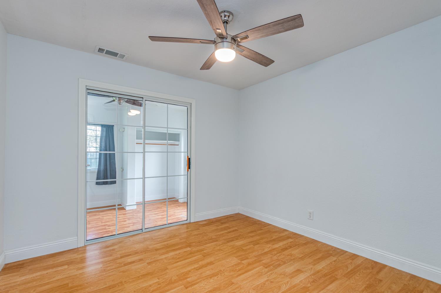 5651 Gerard Way Citrus Heights, CA 95621 - Photo 15 of 31 an empty room with wooden floor and fan