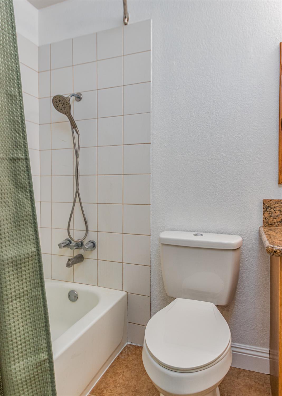 5651 Gerard Way Citrus Heights, CA 95621 - Photo 18 of 31 a white toilet sitting next to a bath tub