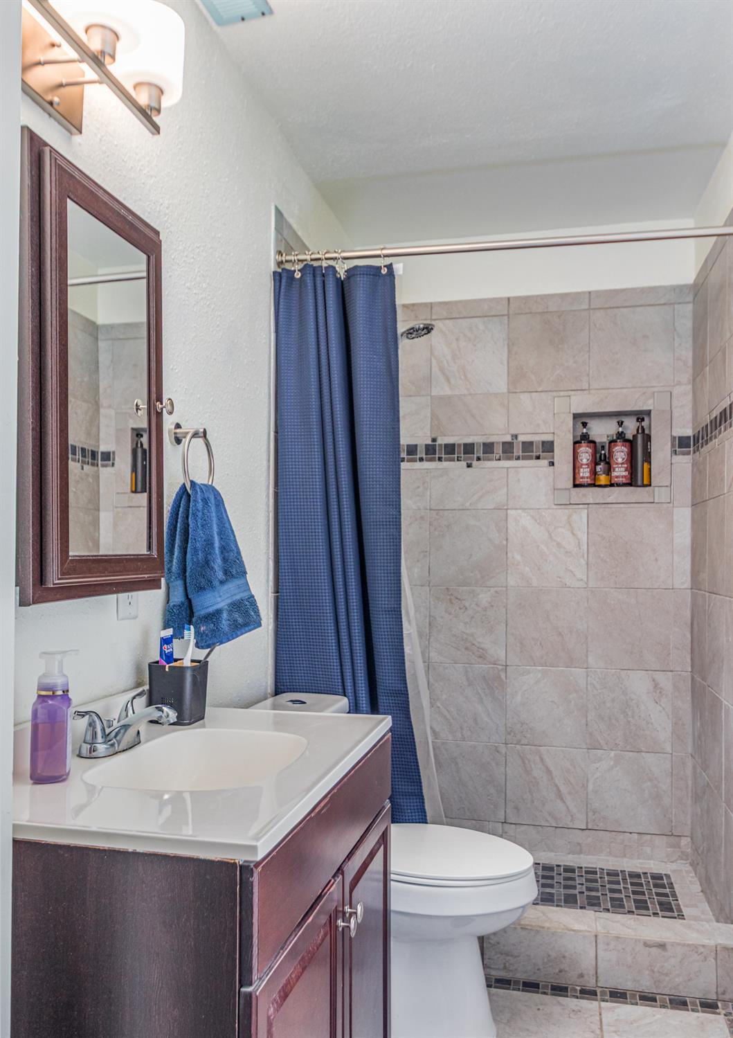 5651 Gerard Way Citrus Heights, CA 95621 - Photo 21 of 31 a bathroom with a sink toilet and shower