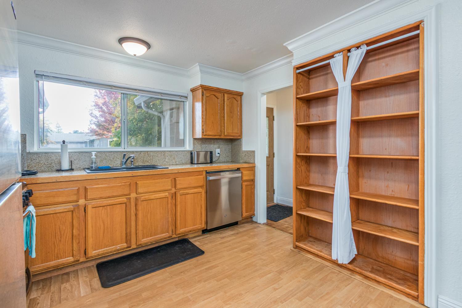 5651 Gerard Way Citrus Heights, CA 95621 - Photo 6 of 31 a kitchen with granite countertop cabinets and window