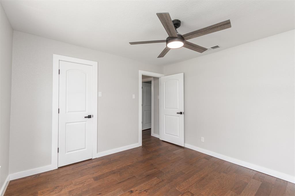 1024 Tower Street Canton, TX 75103 - Photo 12 of 27 a view of a livingroom with a ceiling fan and wooden floor