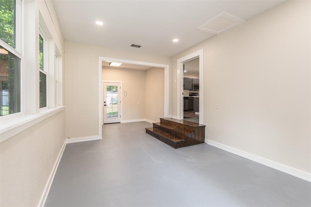 1024 Tower Street Canton, TX 75103 - Photo 16 of 27 a view of a livingroom with wooden floor and a window