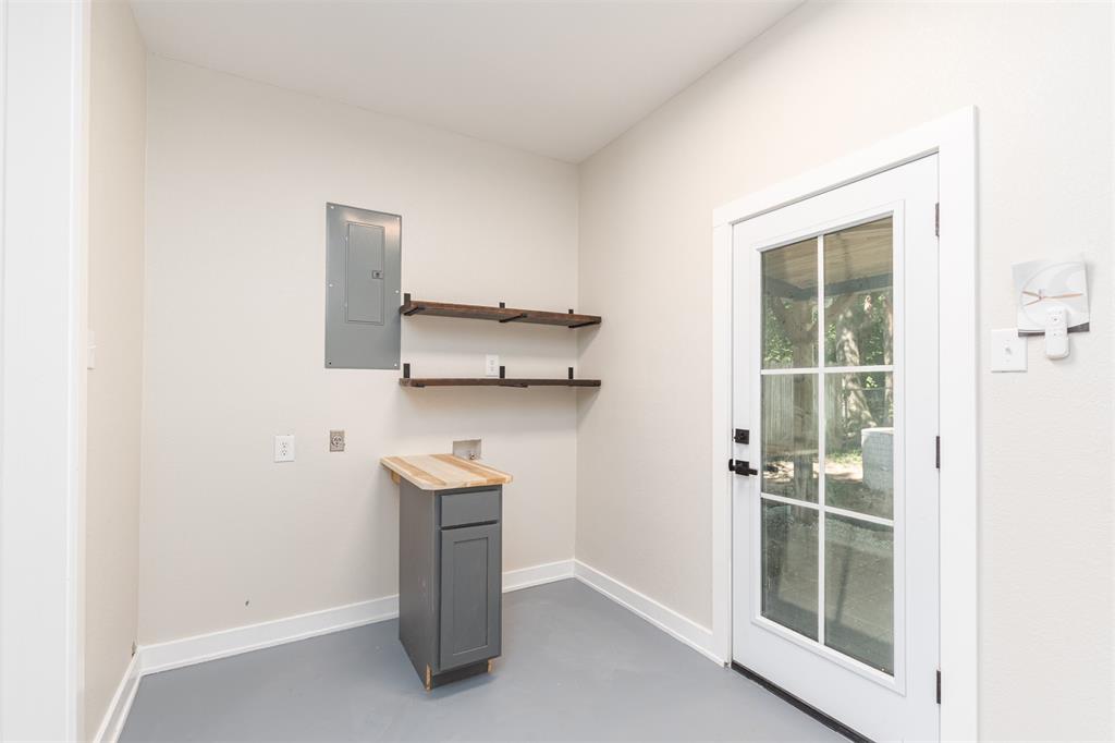 1024 Tower Street Canton, TX 75103 - Photo 18 of 27 a room with a stove and a refrigerator