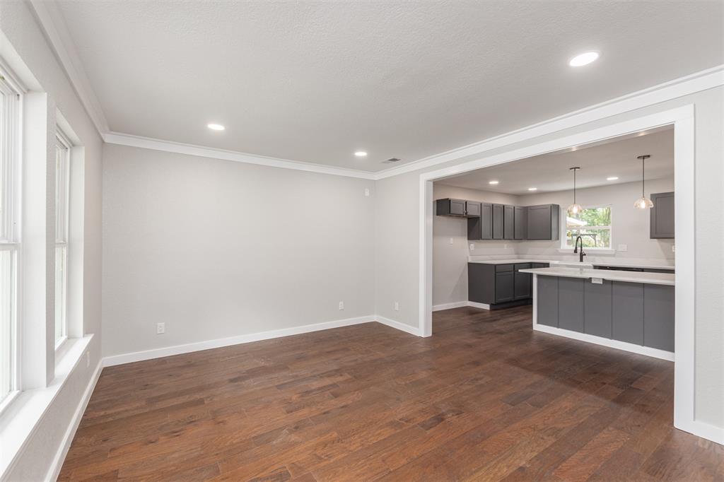 1024 Tower Street Canton, TX 75103 - Photo 2 of 27 a view of kitchen with kitchen island wooden floor center island and stainless steel appliances