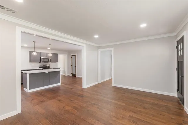 a view of a kitchen and a sink in a room